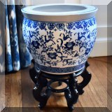 P02. One of a pair of blue and white porcelain jardinieres with rosewood stands. 
